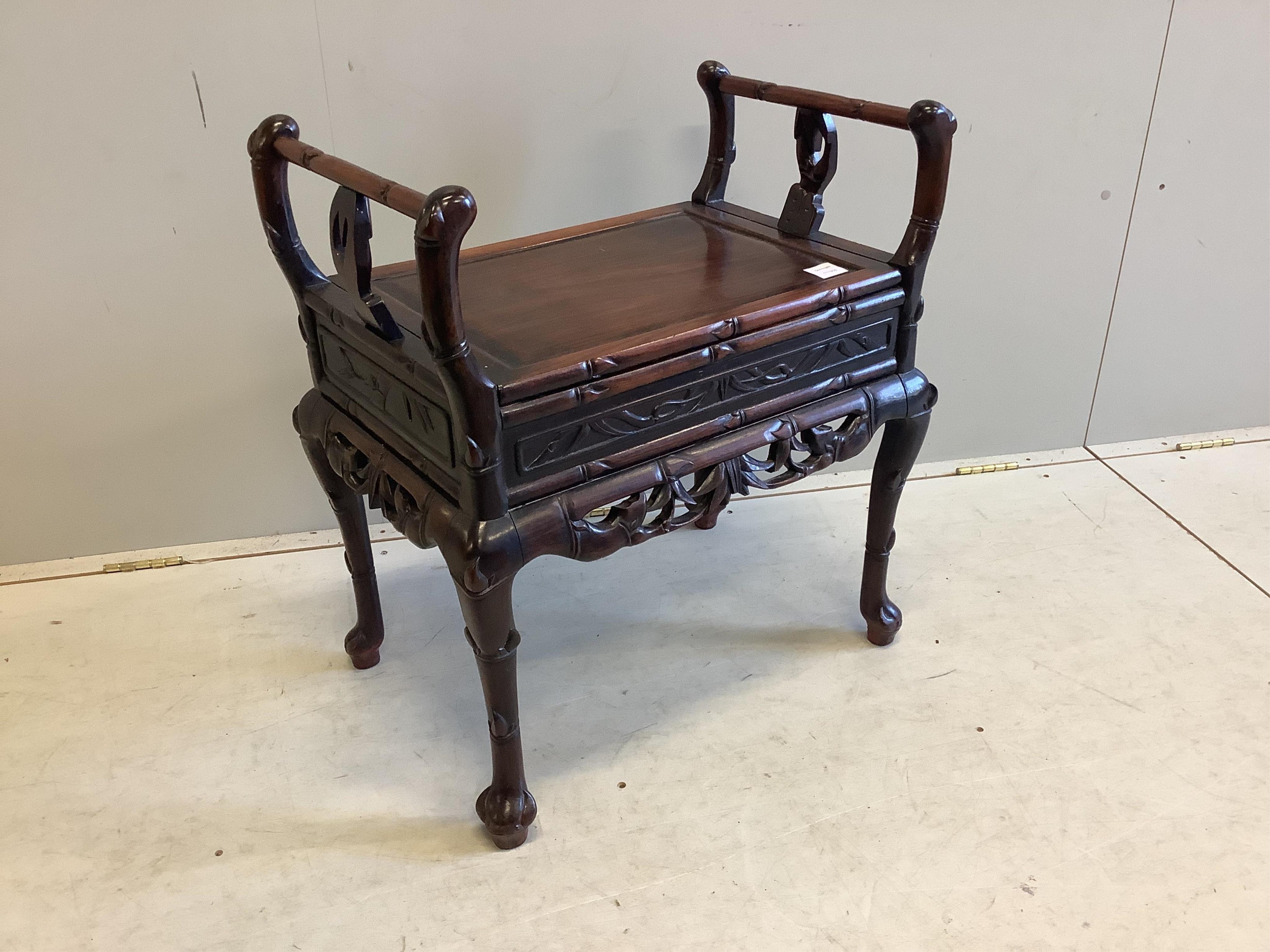 A Chinese hardwood piano stool, width 64cm, depth 43cm, height 70cm. Condition - good